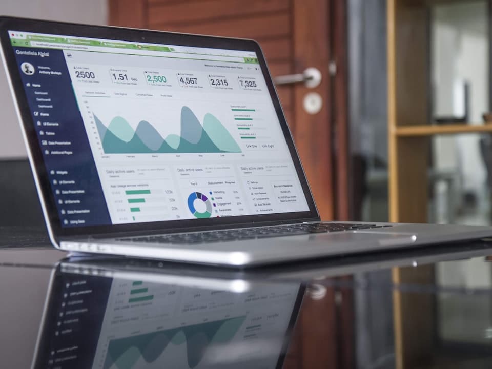 Laptop showing data charts ready for export and analysis